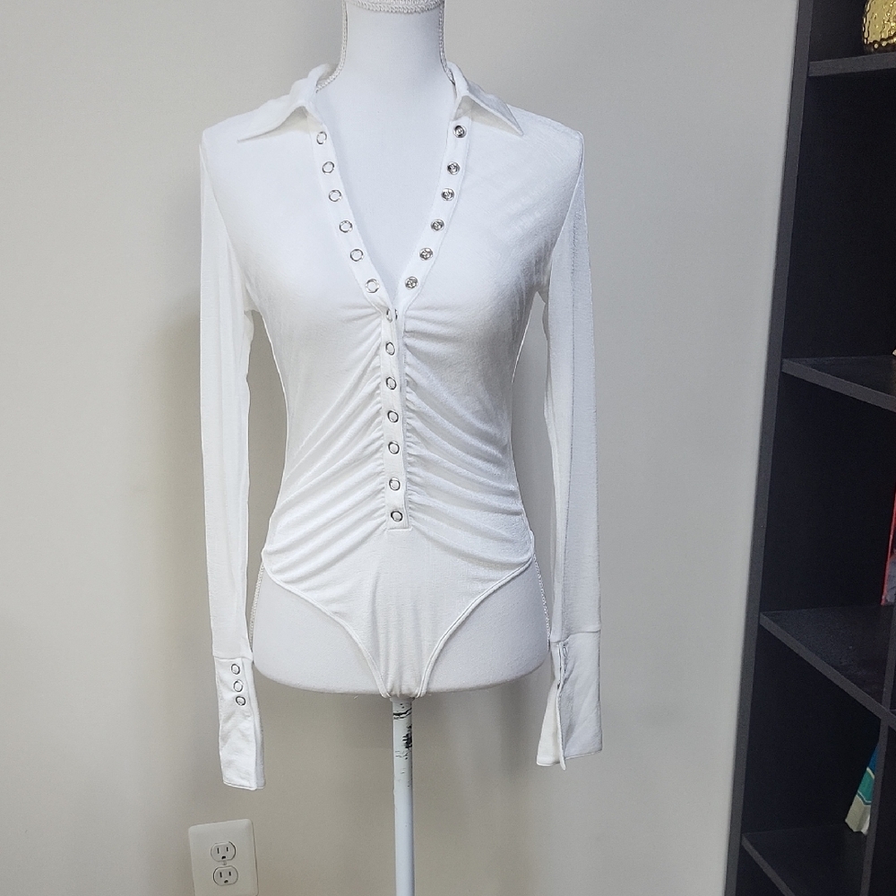 ATOIR The Palmer Bodysuit In White Snap Down Front Long Cuffed Sleeves